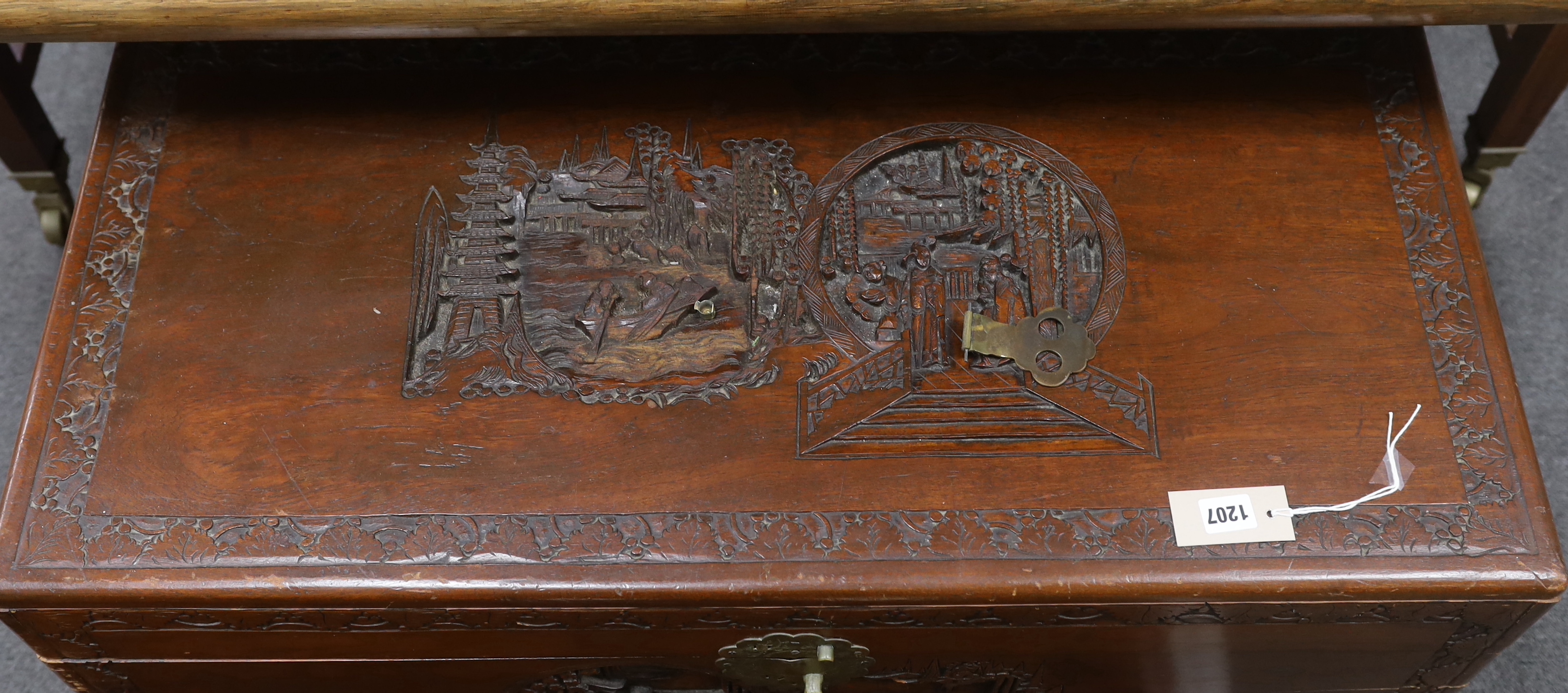 A Chinese carved camphor wood trunk, width 93cm, depth 44cm, height 48cm